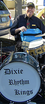 Bob Lord sitting at Dixie Rhythm Kings drum set.