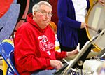 Bob Lord sitting at drum set, wering Saint Louis Cardinals sjirt.