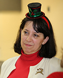 A picture of Rene Sanders wearing a holiday hat.