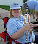 A picture of Sandra Stoeckel with her trumpet.