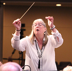 A picture of Sandra Stoeckel conducting.